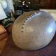 Vintage sandstone vase, in the shape of a rugby ball, signed