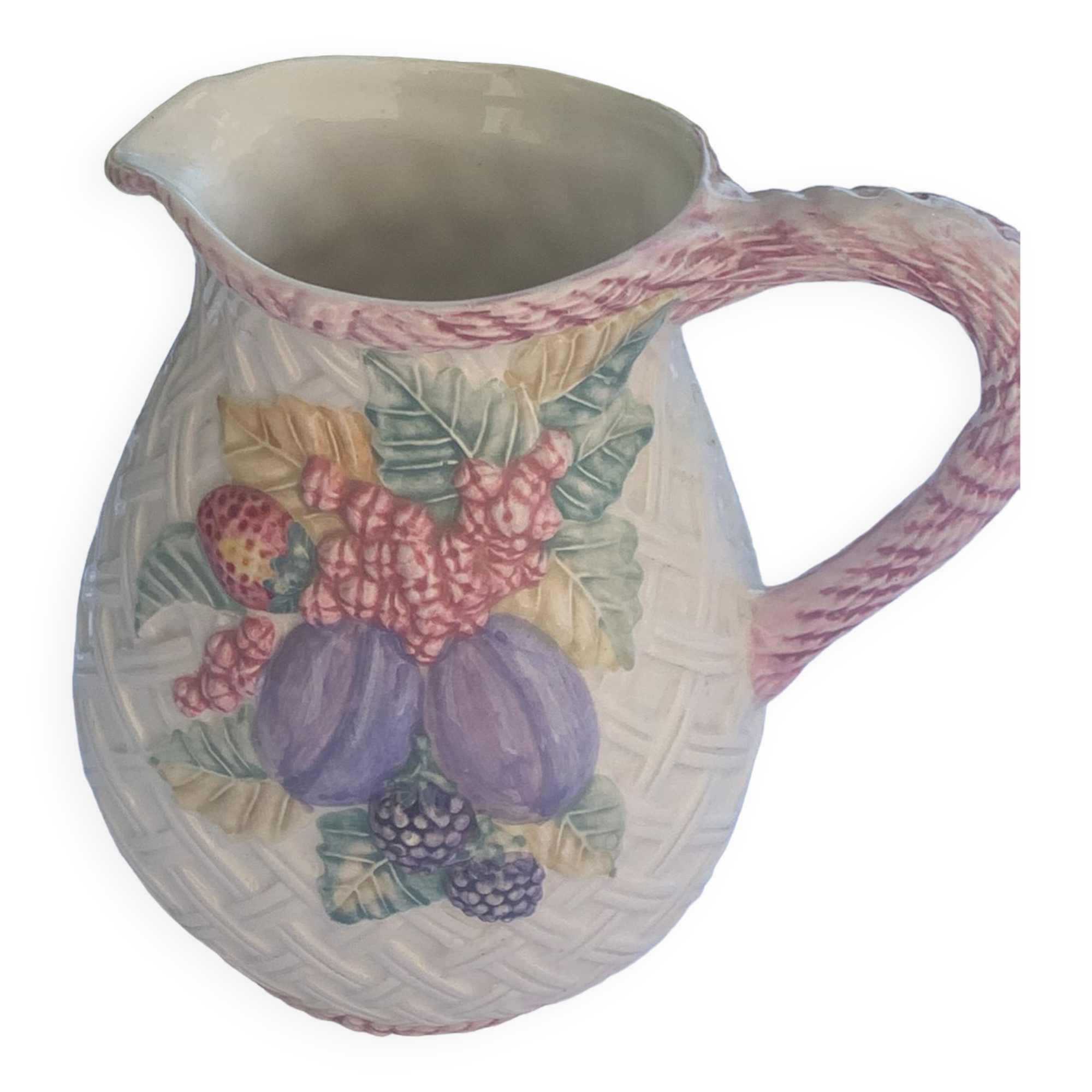 Glazed ceramic slip jug with vintage basket and fruit motif