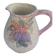 Glazed ceramic slip jug with vintage basket and fruit motif