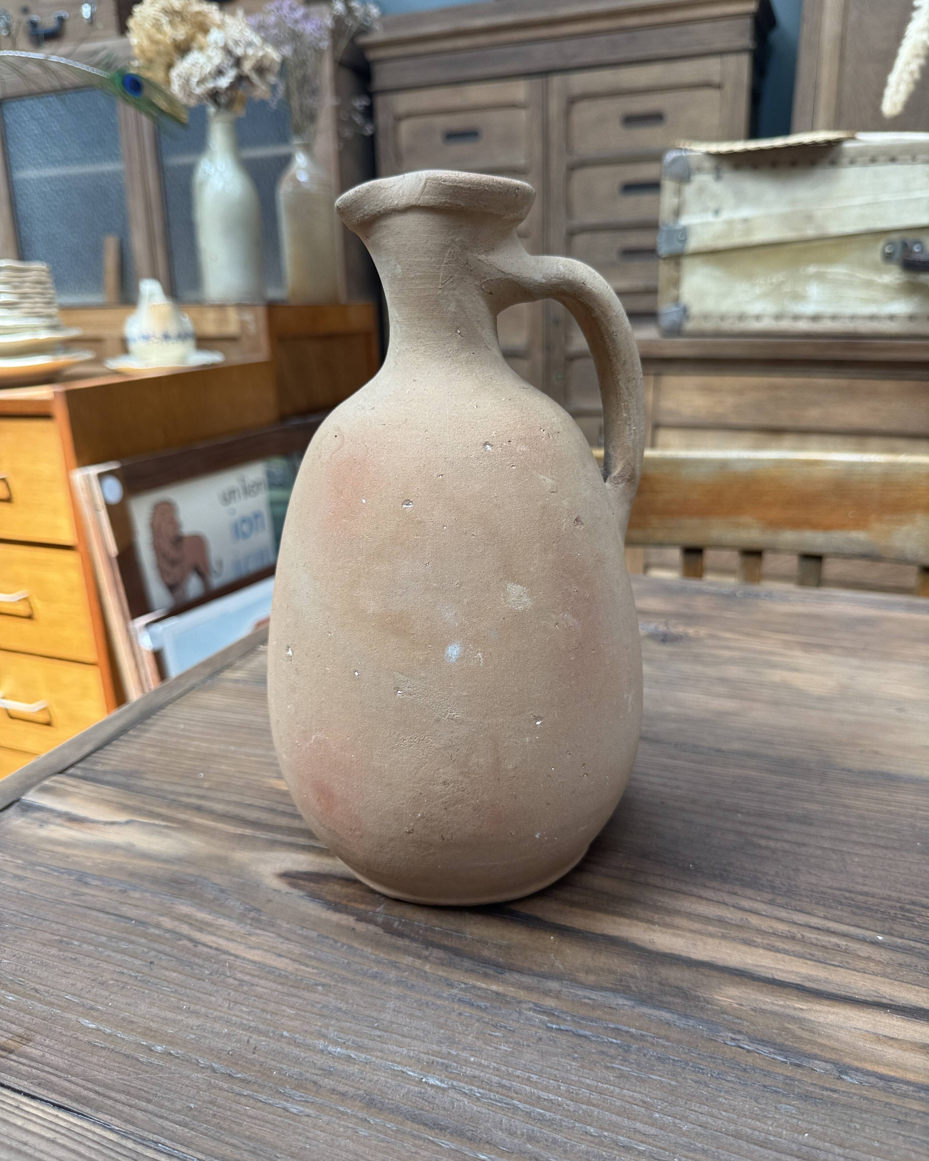 Unfired clay pitcher