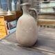 Unfired clay pitcher