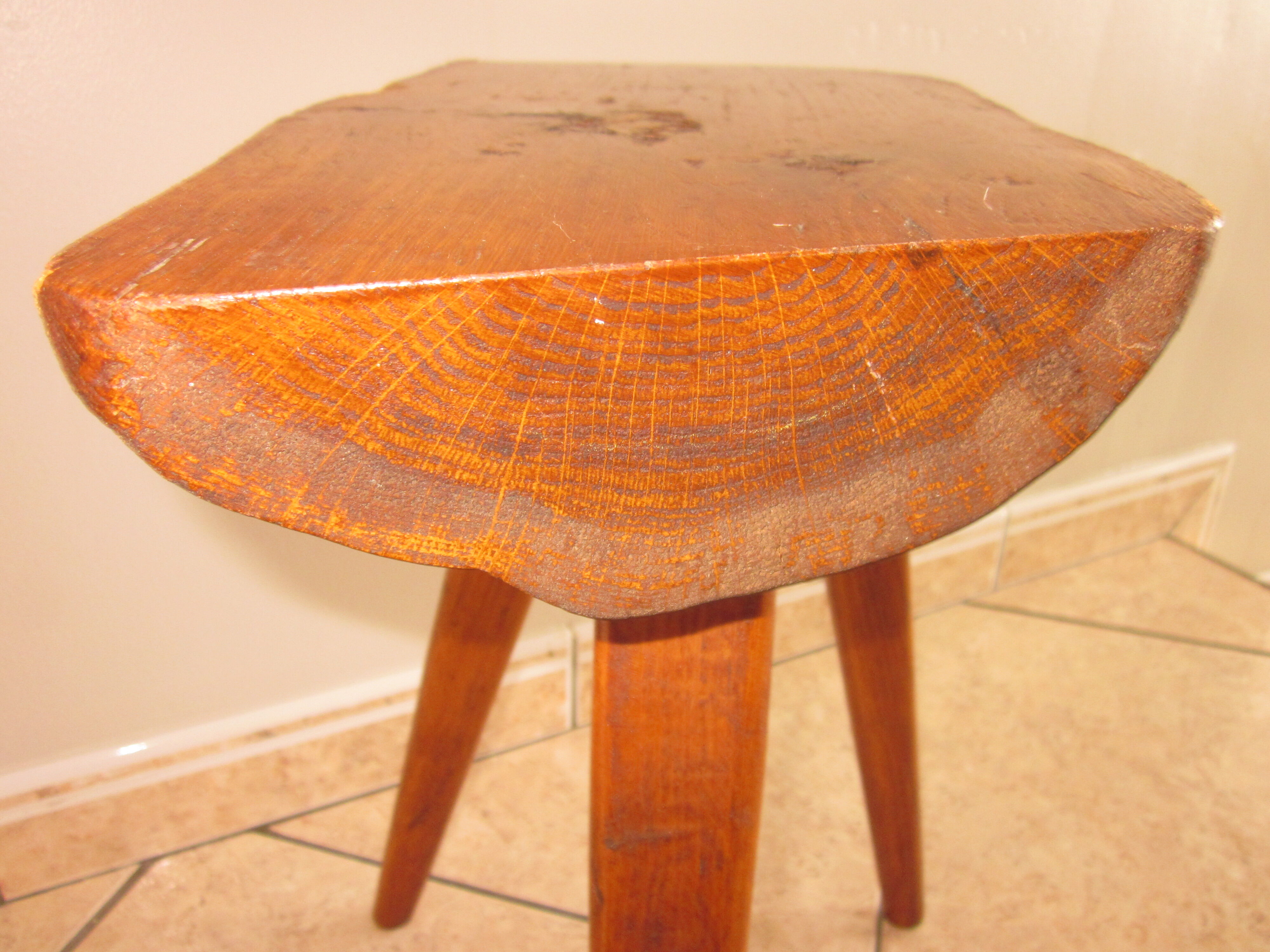 Raw wooden tripod stool