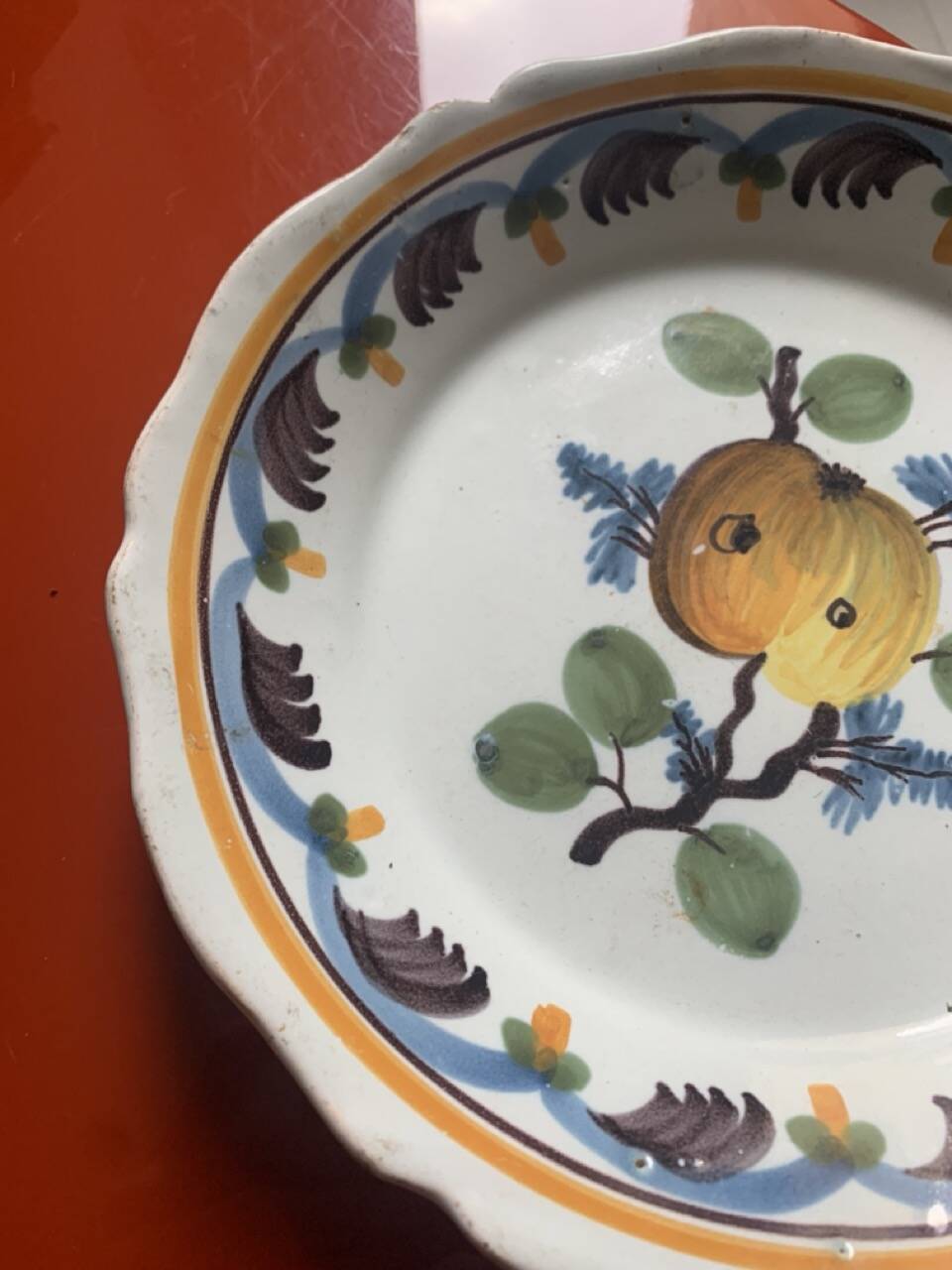 Antique earthenware soup plate with plum decoration