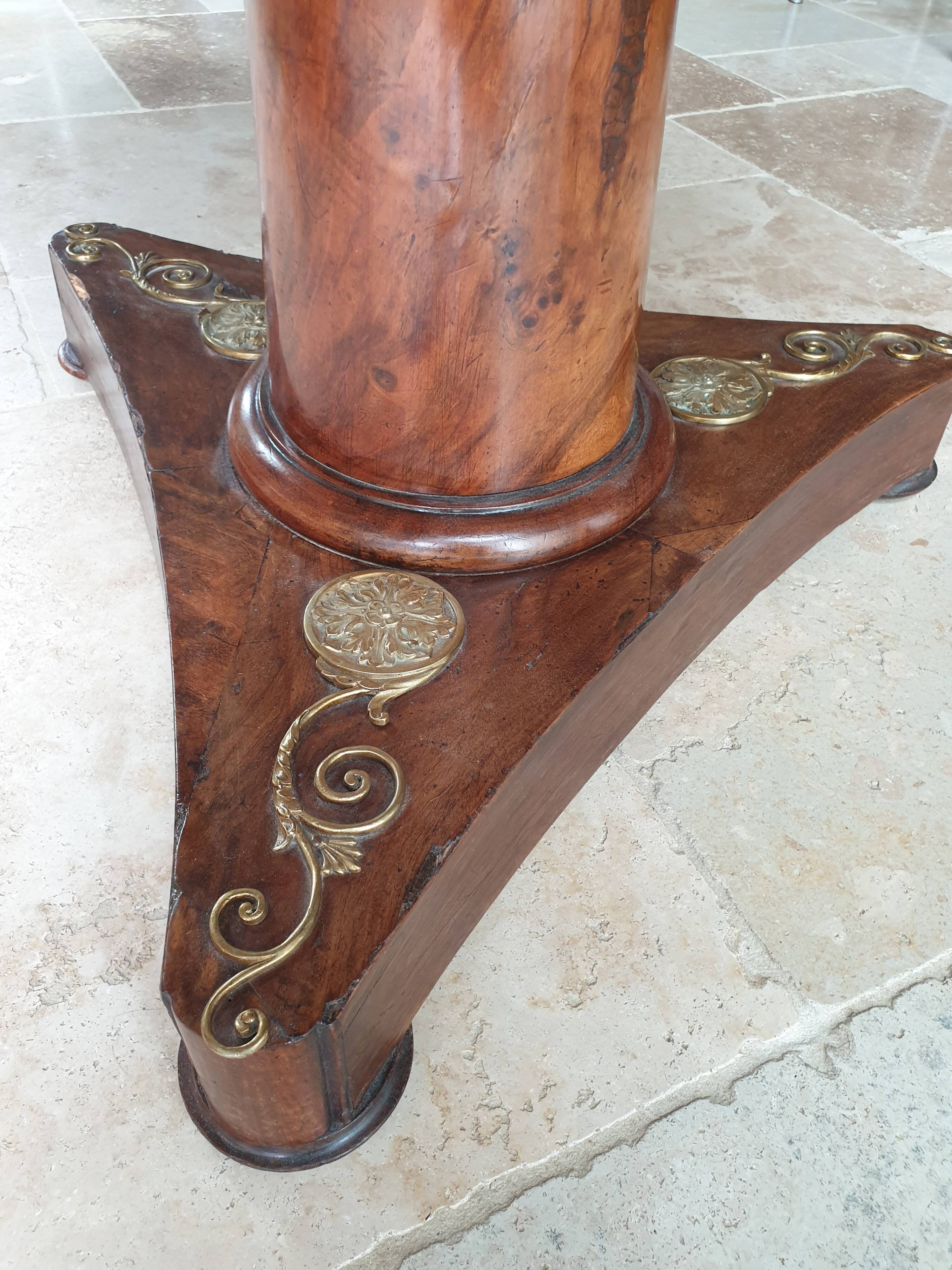 Pedestal table above marble