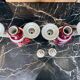 Pair of Limoges porcelain candlesticks with hand-decorated decoration – red and gold