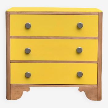 Powder yellow art deco chest of drawers and raw wood