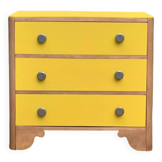 Powder yellow art deco chest of drawers and raw wood