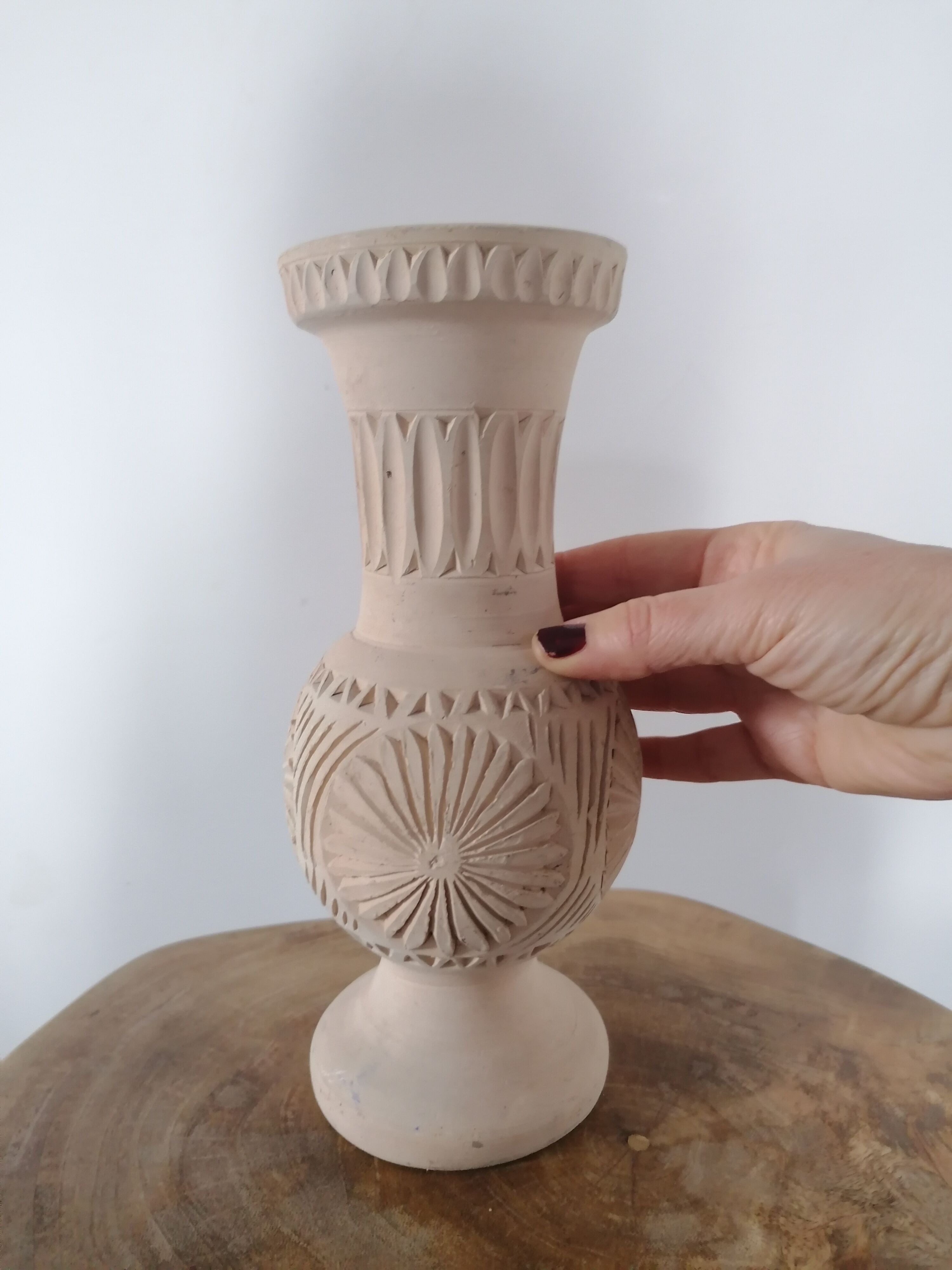 Clear natural terracotta vase decorated ethnic motifs