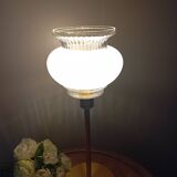 Table lamp with gold metal base and vintage white glass lampshade