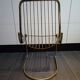 Tubular metal chair covered with gilding