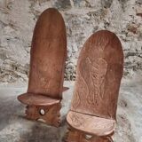 Pair of hand-carved wooden folding chairs – African origin, animal and face motifs, mid-20th century