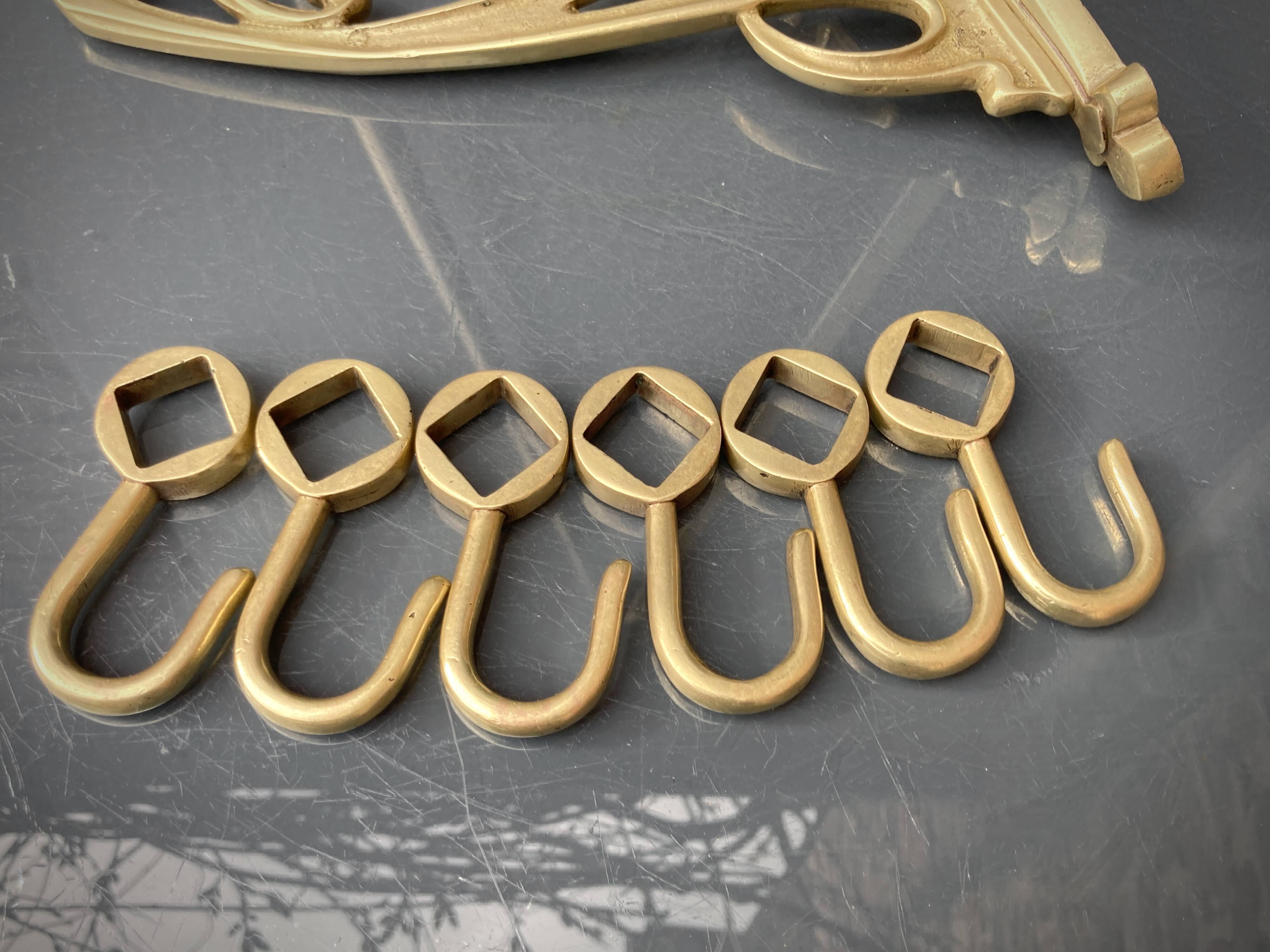 Art-deco wall-mounted coat rack in brass