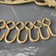 Art-deco wall-mounted coat rack in brass