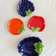 bowls and cups in slipware fruits