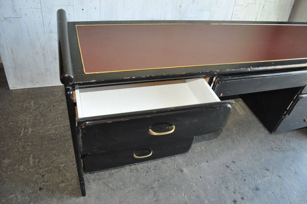 Hungarian Art Deco desk in black painted wood with a brown top and metal handles.