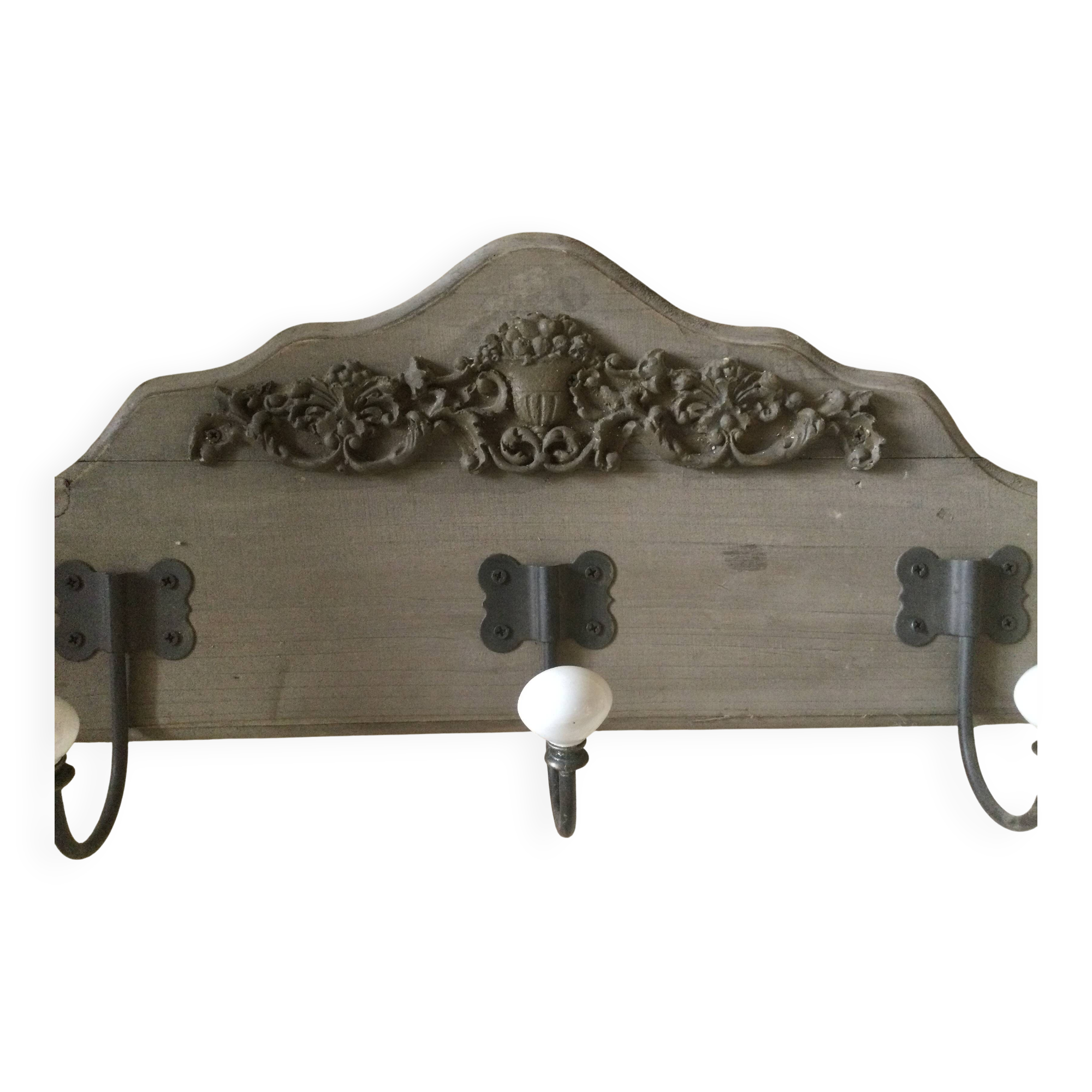 Wall-mounted wooden coat rack with 3 hooks.