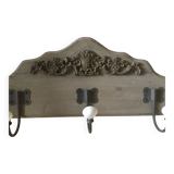Wall-mounted wooden coat rack with 3 hooks.