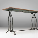 French bistro table with elegant metal base and oak top, ca. 1890