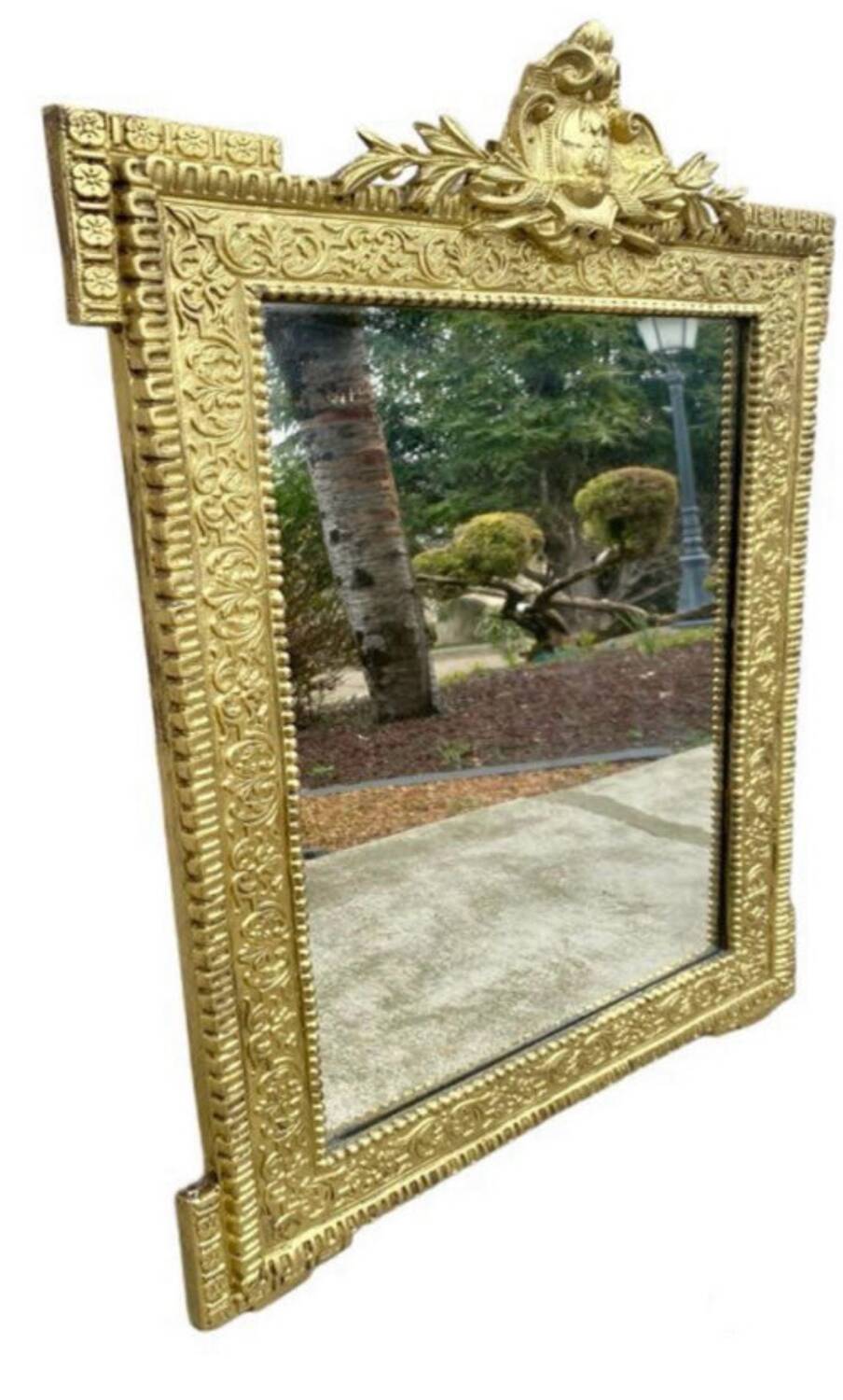 19th-century antique mirror in carved gilded wood, Napoleon style.
