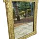 19th-century antique mirror in carved gilded wood, Napoleon style.