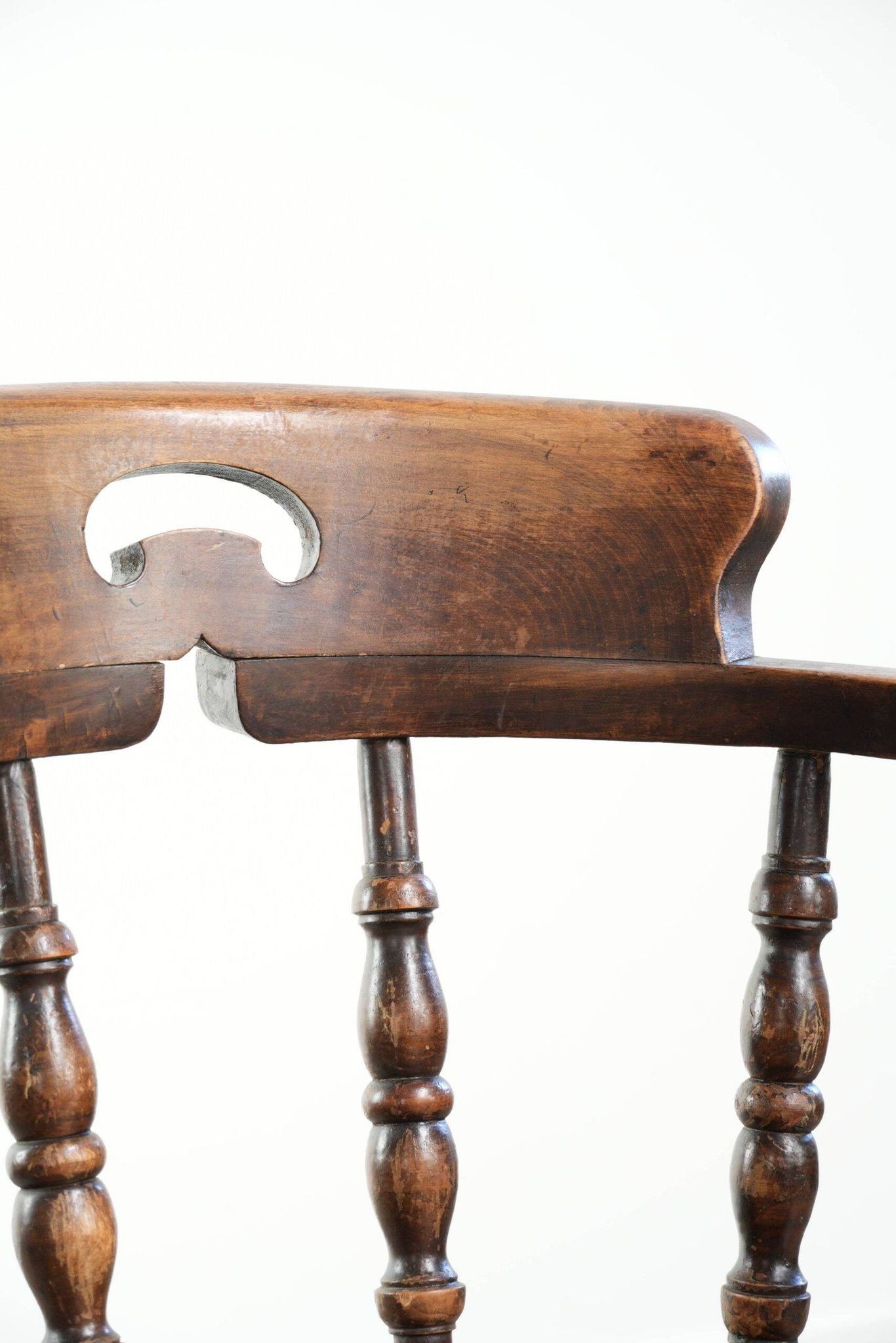 Wooden English antique pub/captain chair from the late 19th century