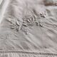 Antique embroidered linen sheet with a monogram.