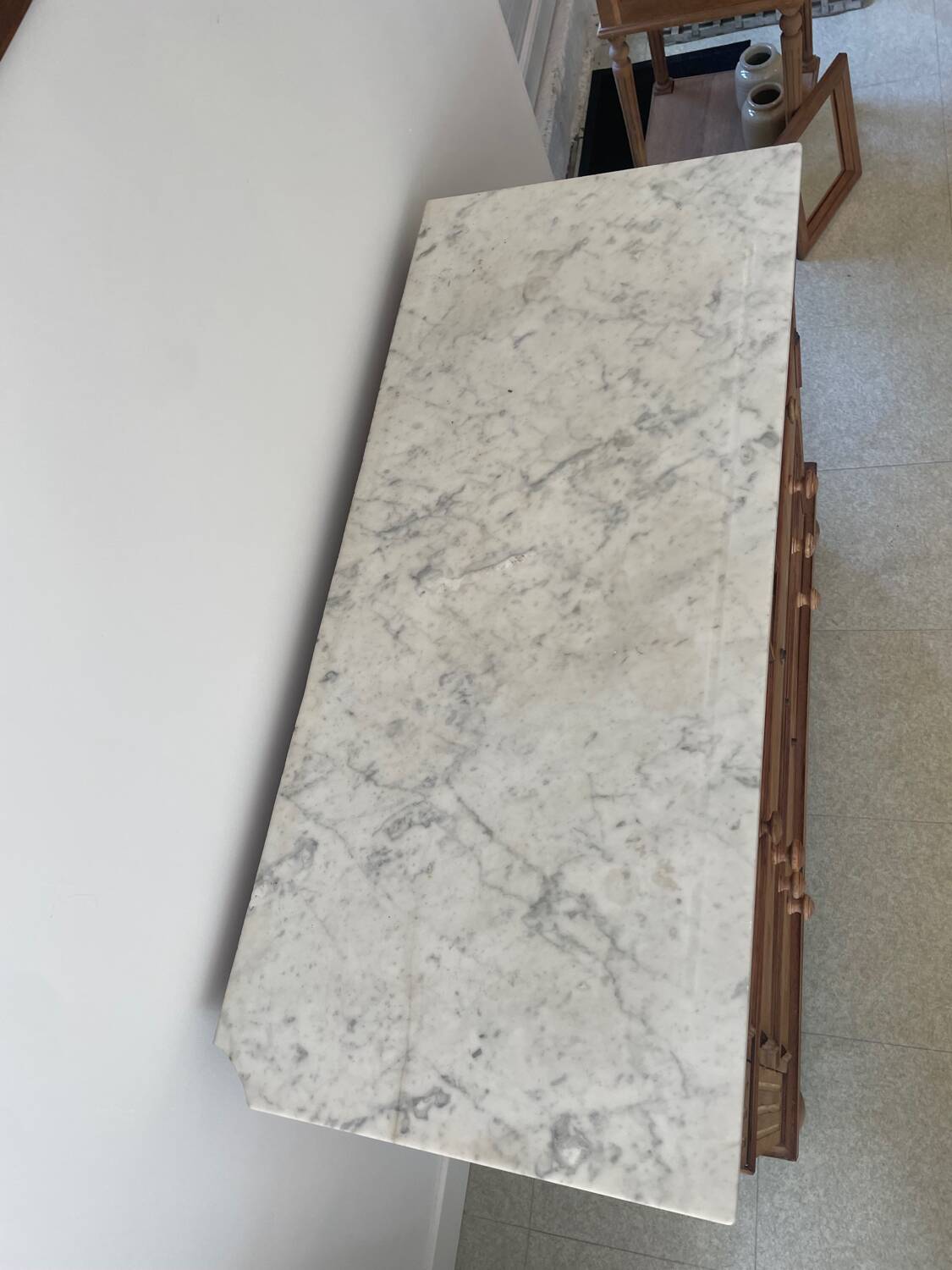 Sandblasted chest of drawers with white marble top