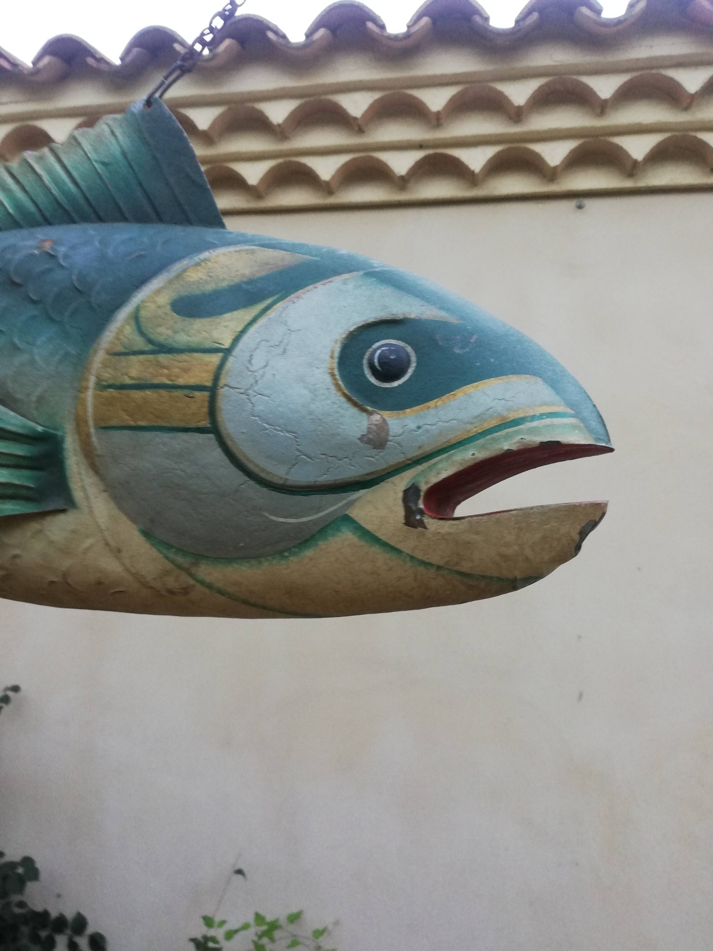 Panel depicting a fish in sheet metal