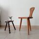 Low brutalist tripod chair in solid oak from the 1960s.