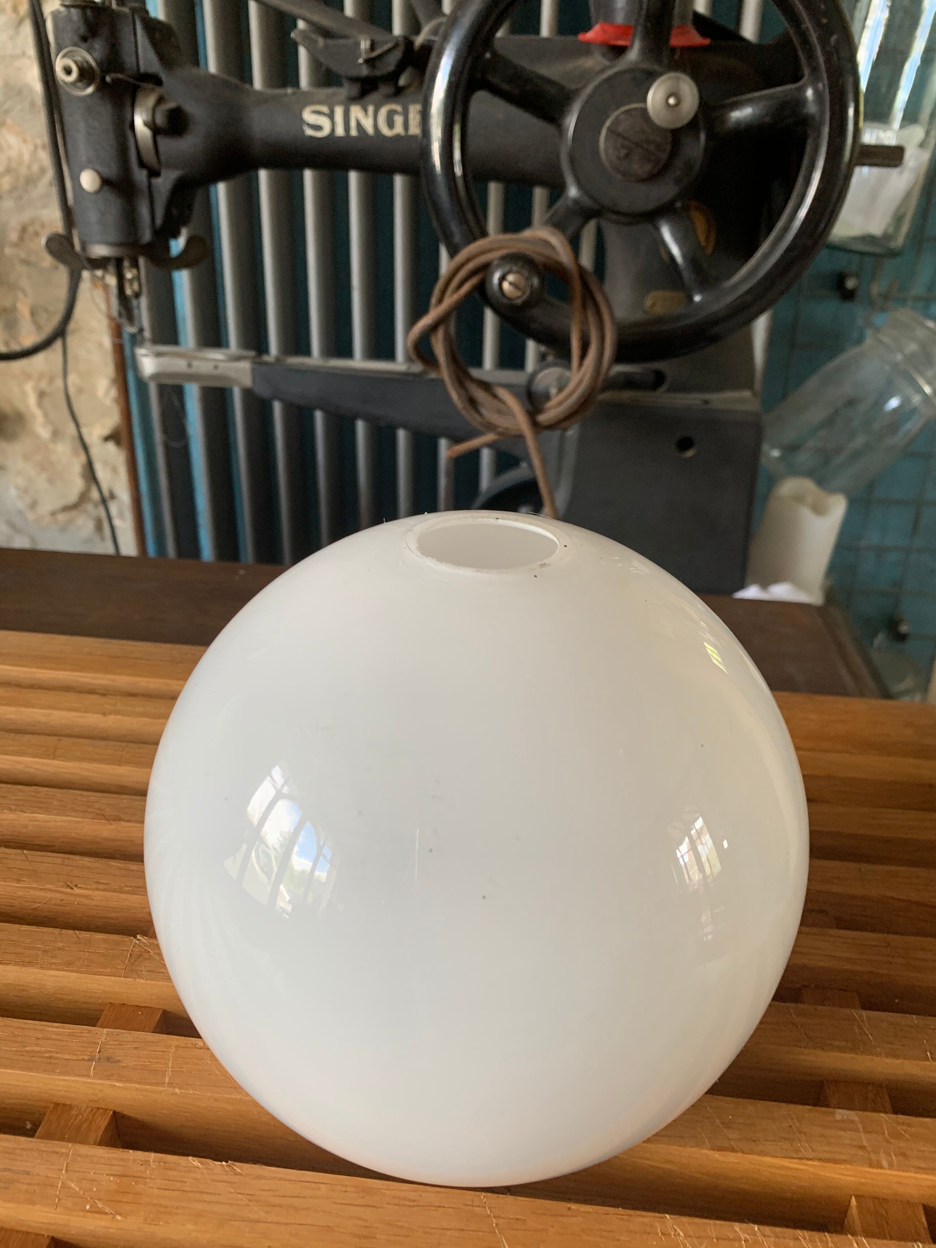 Globe ball in vintage white opaline