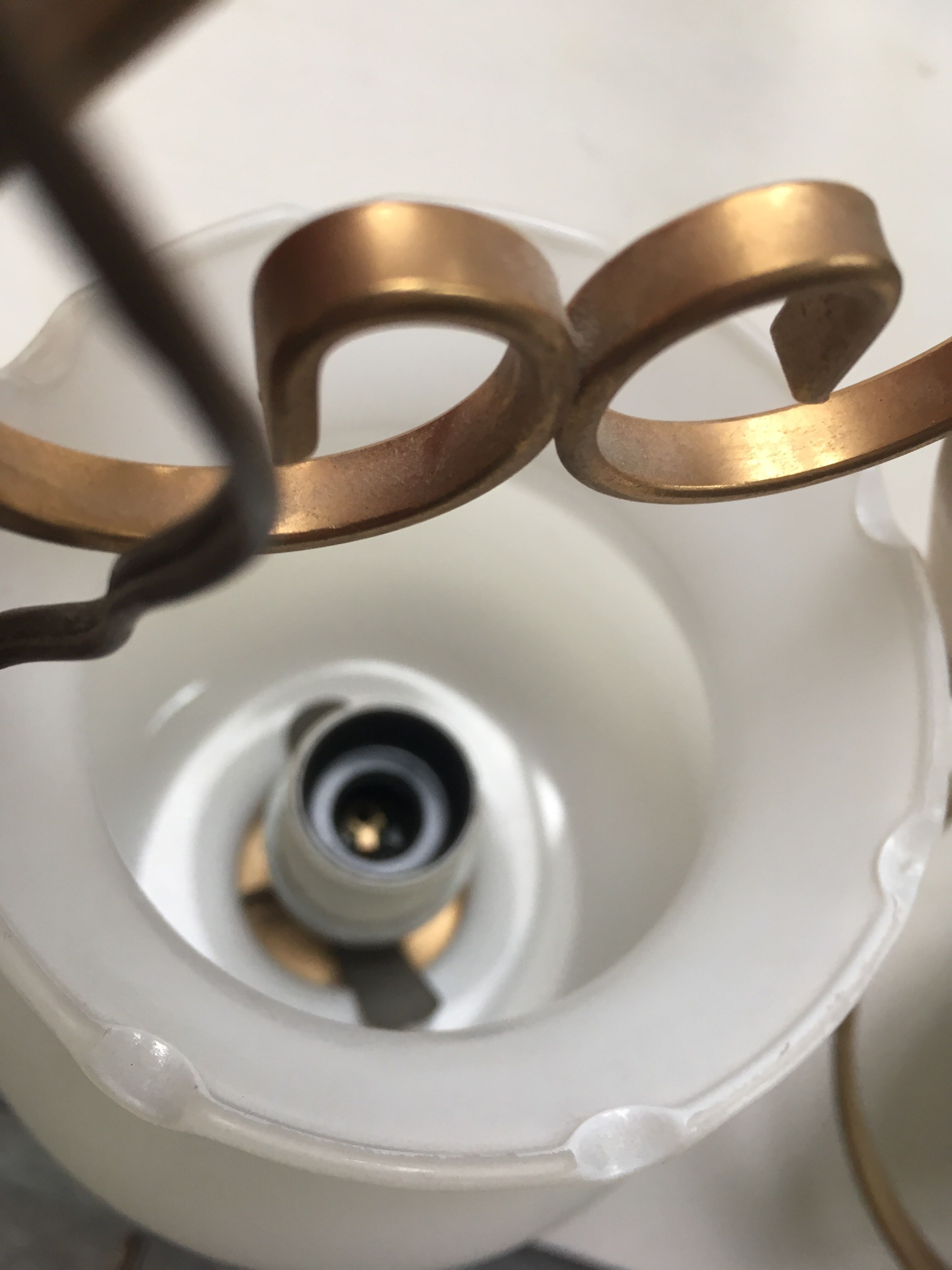 Pair of white tulip and brass pendant lamps