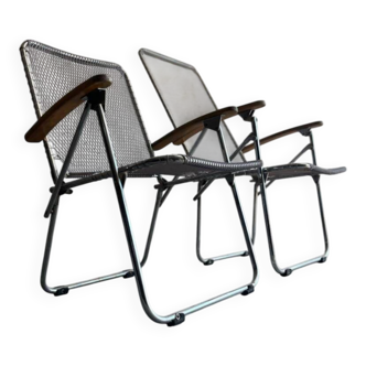 Pair of vintage silver aluminum wire folding chairs with wooden armrests — industrial minimalist