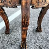 Old wooden saddle pedestal table with claw feet