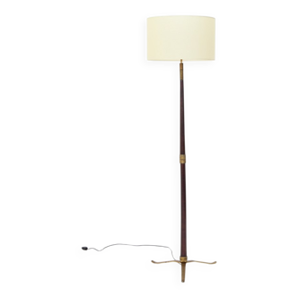 Floor lamp with a brass base and parchment shade, 1940s.