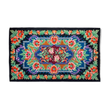 Rug with floral design on a blue background made by hand in Romania