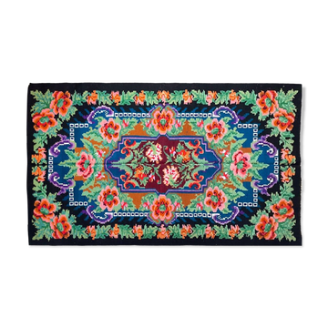 Rug with floral design on a blue background made by hand in Romania