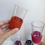 set of 9 small glasses with colored rattan support from the 70s