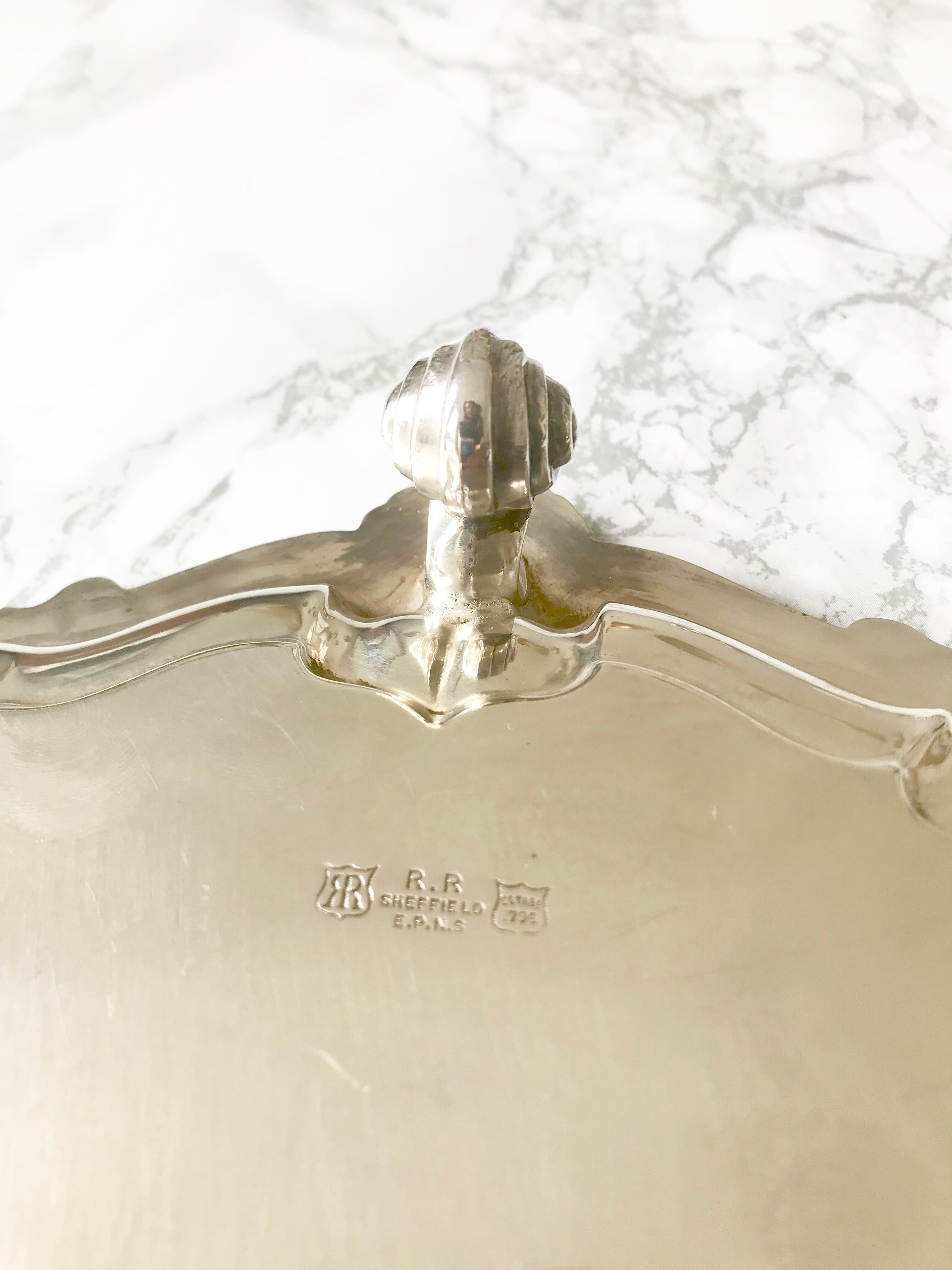 Antique silver metal platter with rockery décor