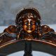 Fauteuil d'angle néo-renaissance en noyer sculpté