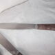 Set of knives with brown Bakelite handles.