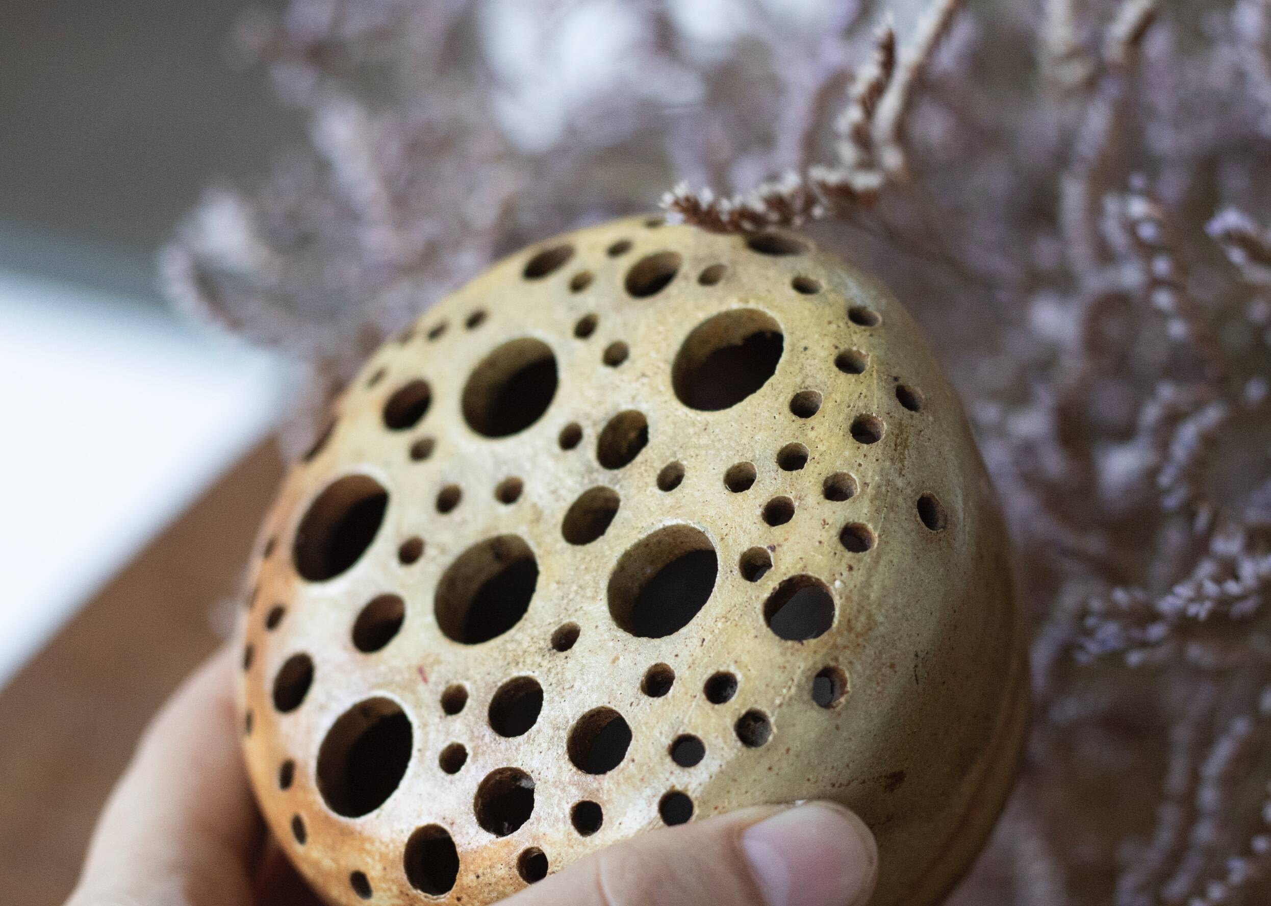 Signed sandstone flower pick