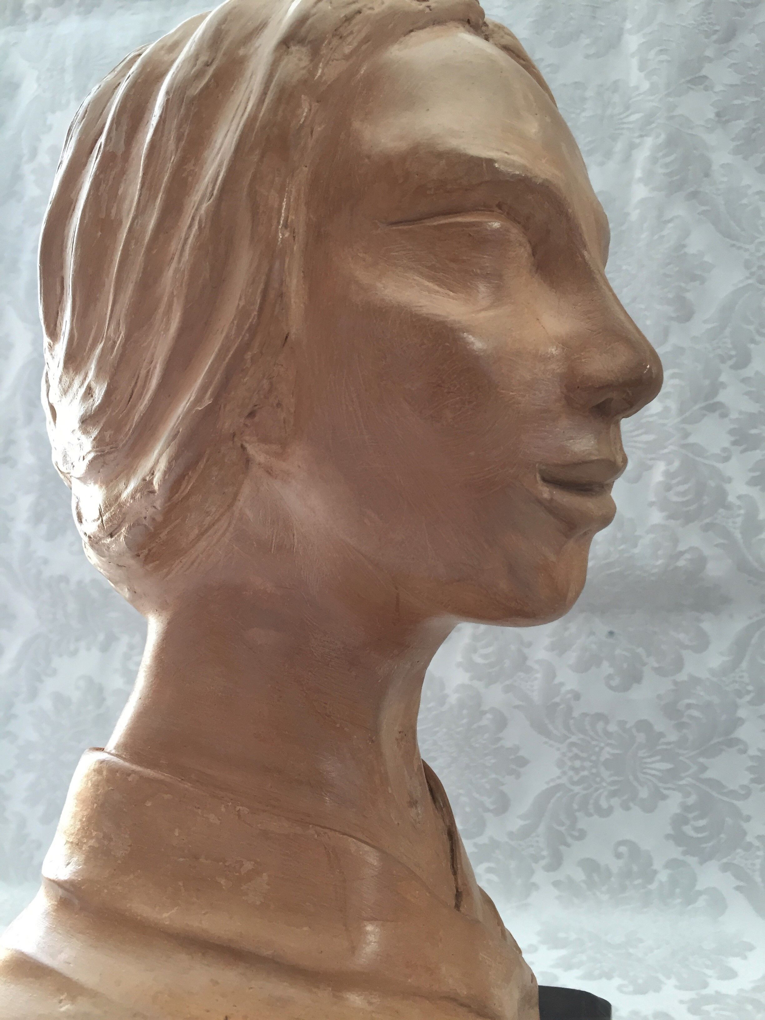 Bust in raw earth of atelier bust face of woman signed j.c.g.