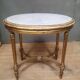 Oval coffee table in gilded wood in the Louis XVI style.