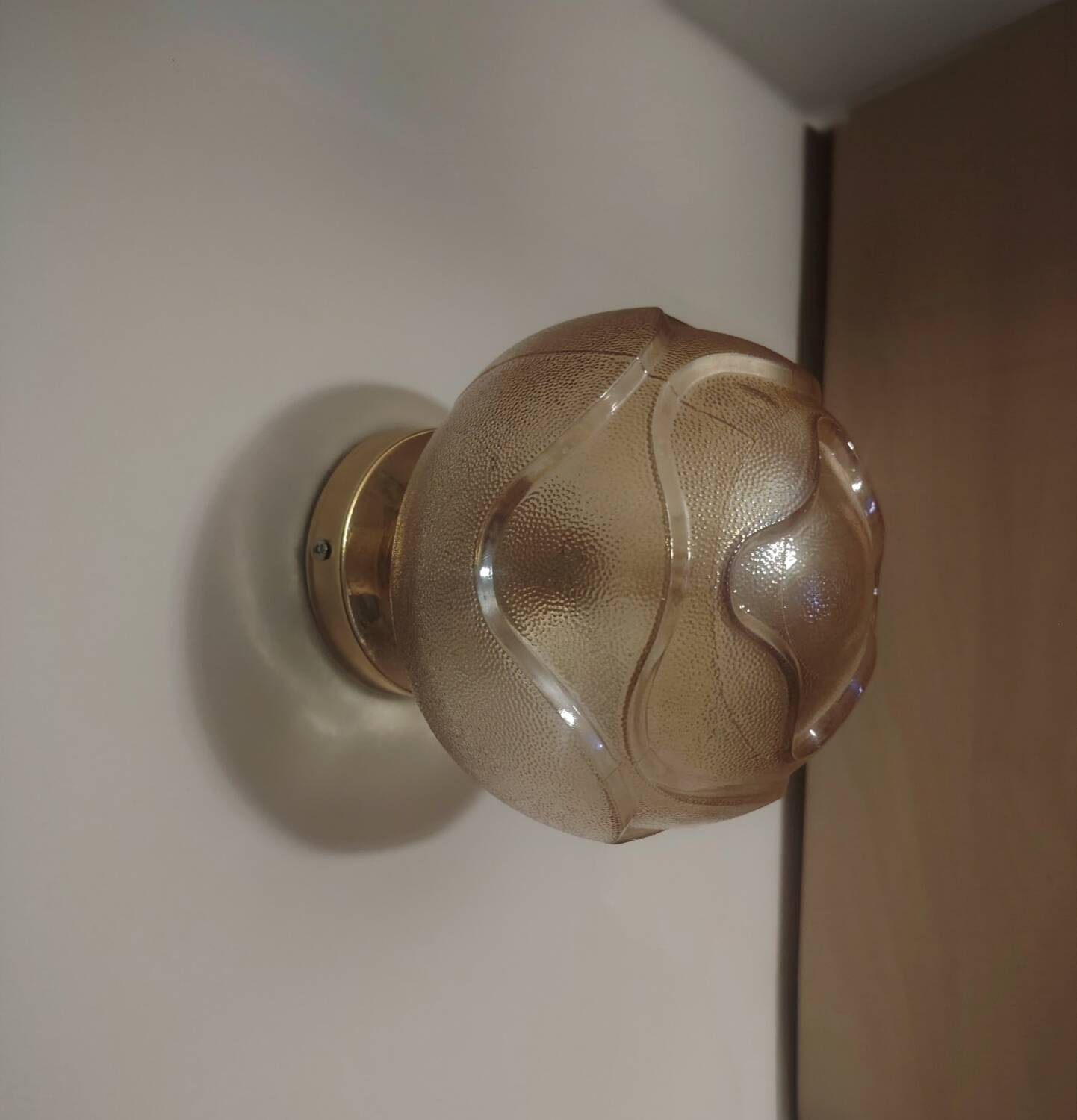 Textured amber globe wall light