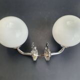 Pair of chrome wall sconces for bathroom with vintage fish pattern.
