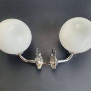 Pair of chrome wall sconces for bathroom with vintage fish pattern.