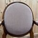 Pair of Louis XVI cabriolet armchairs with medallion backrest.