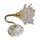 Brass flower and frosted glass sconce