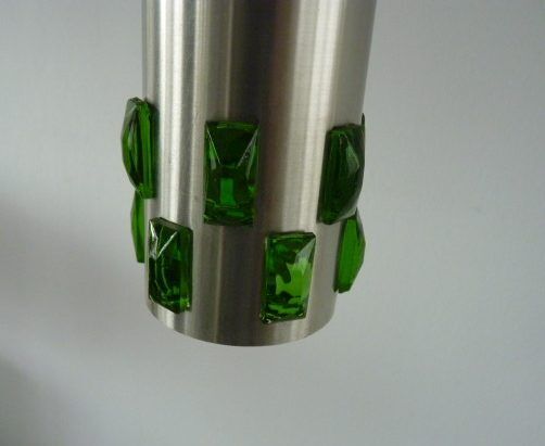 Suspension cascade of aluminum tubes with green glass