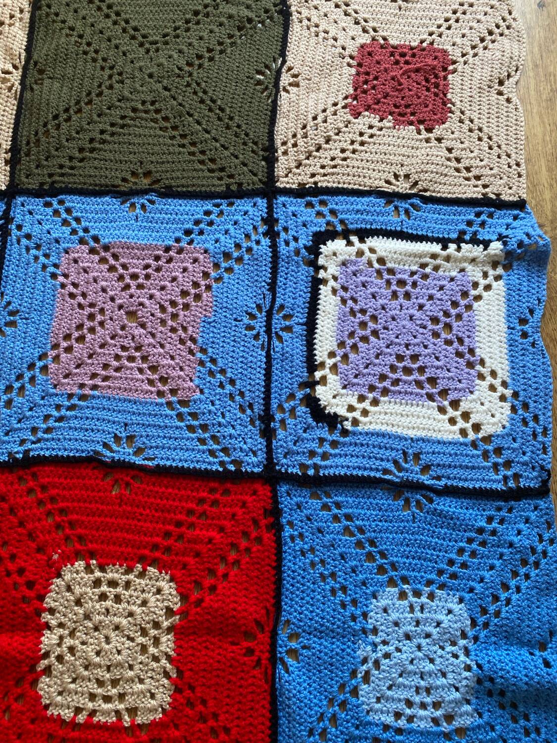 Hand-knitted patchwork blanket
